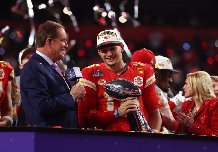 Kansas City Chiefs quarterback Patrick Mahomes (15) celebrates with the Vince Lombardi Trophy after defeating the San Francisco 49ers in Super Bowl LVIII at Allegiant Stadium