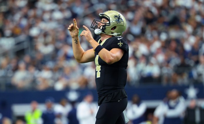 New Orleans Saints quarterback Derek Carr (4) reacts after a touchdown during the second half against the Dallas Cowboys at AT&T Stadium on September 15, 2024.