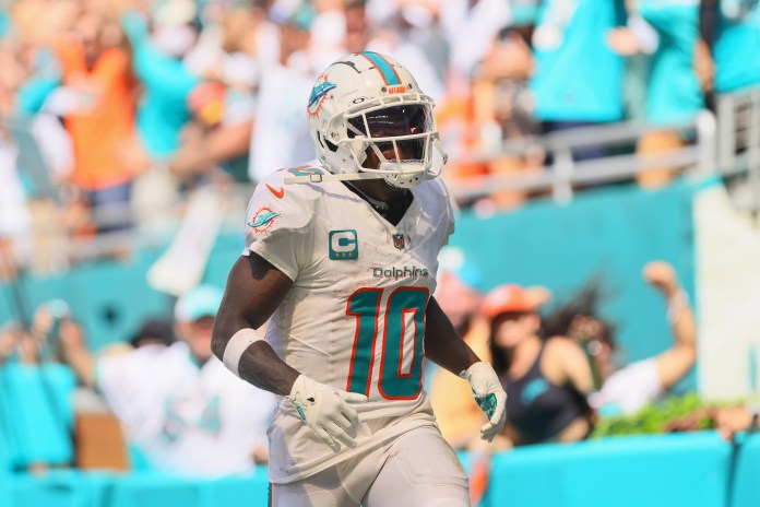 Miami Dolphins wide receiver Tyreek Hill (10) runs in the end zone after scoring a touchdown against the Jacksonville Jaguars during the third quarter at Hard Rock Stadium on September 8, 2024.