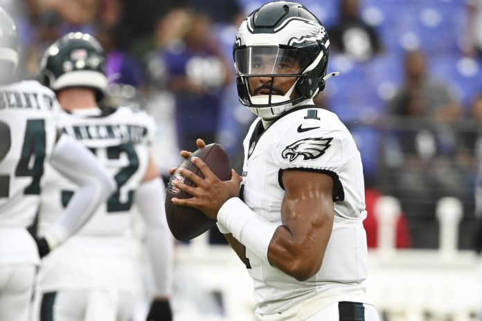 Philadelphia Eagles quarterback Jalen Hurts warms up before a preseason meeting with the Baltimore Ravens.