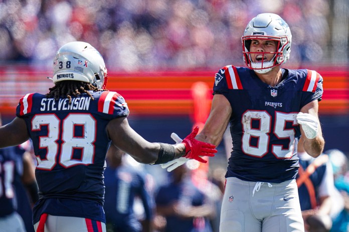 New England Patriots tight end Hunter Henry (85) reacts after running the ball against the Seattle Seahawks in the second quarter at Gillette Stadium on September 15, 2024.