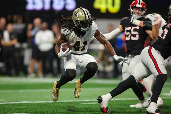 New Orleans Saints running back Alvin Kamara (41) runs with the ball during the fourth quarter against the Atlanta Falcons at Mercedes-Benz Stadium on September 29, 2024.