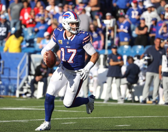 Bills quarterback Josh Allen looks for an open receiver during second half action at Highmark Stadium