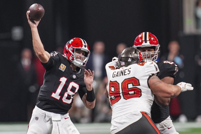 Atlanta Falcons quarterback Kirk Cousins (18) throws a pass during the second half against the Tampa Bay Buccaneers at Mercedes-Benz Stadium on October 3, 2024.