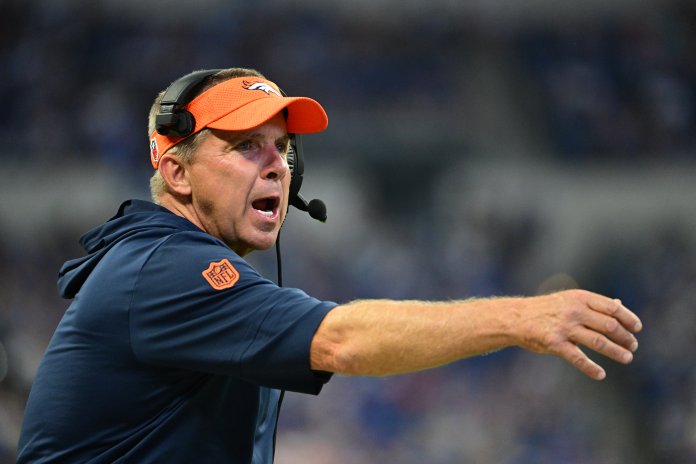 Denver Broncos Head Coach Sean Payton throws a challenge flag during the second half against the Indianapolis Colts at Lucas Oil Stadium