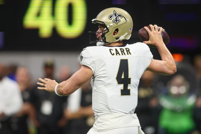 New Orleans Saints quarterback Derek Carr (4) throws a pass during the first quarter against the Atlanta Falcons at Mercedes-Benz Stadium on September 29, 2024.