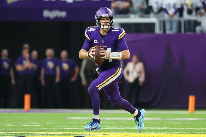 Vikings quarterback Sam Darnold looks to make a play against the Falcons during the 2024 NFL season.