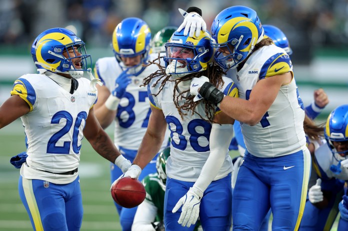 Los Angeles Rams wide receiver Jordan Whittington (88) celebrates with Ronnie Rivers (20) and Hunter Long (84) after recovering a muffed punt by the New York Jets in the fourth quarter at MetLife Stadium on December 22, 2024.