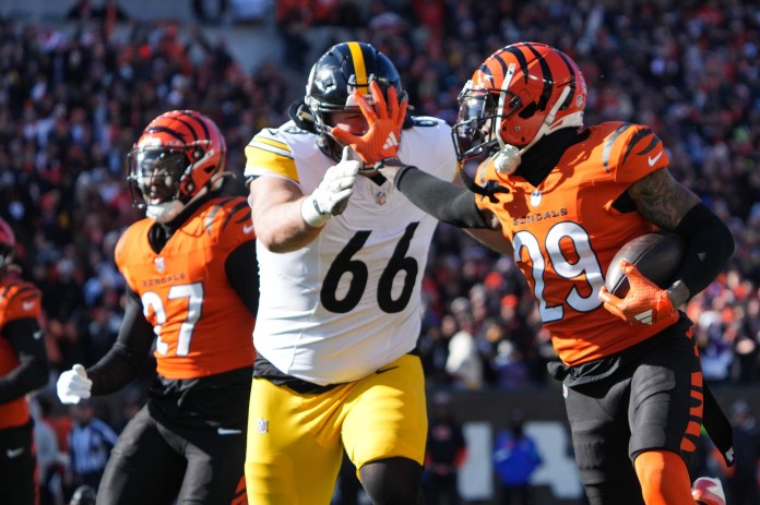 Bengals cornerback Cam Taylor-Britt (29) intercepts the ball and returns it for a touchdown during the game against the Steelers at Paycor Stadium on December 1, 2024. The Steelers led 27-21 at halftime.