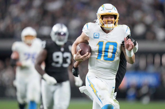 Los Angeles Chargers quarterback Justin Herbert (10) runs for 41 yards during the second half against the Las Vegas Raiders at Allegiant Stadium on January 5, 2025